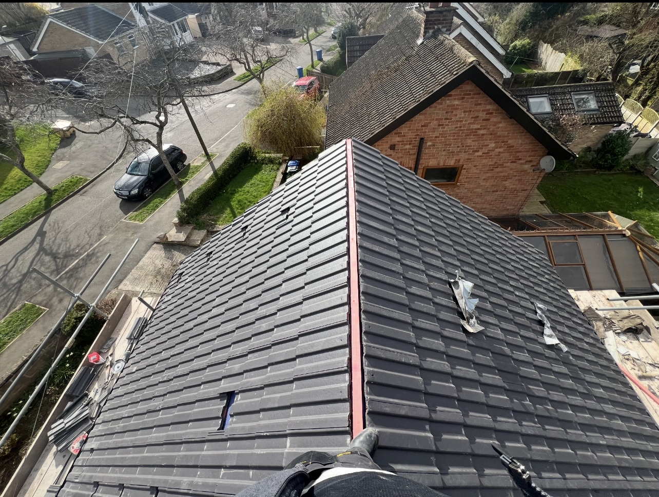 Dark tiled roof — First Choice Roofing project