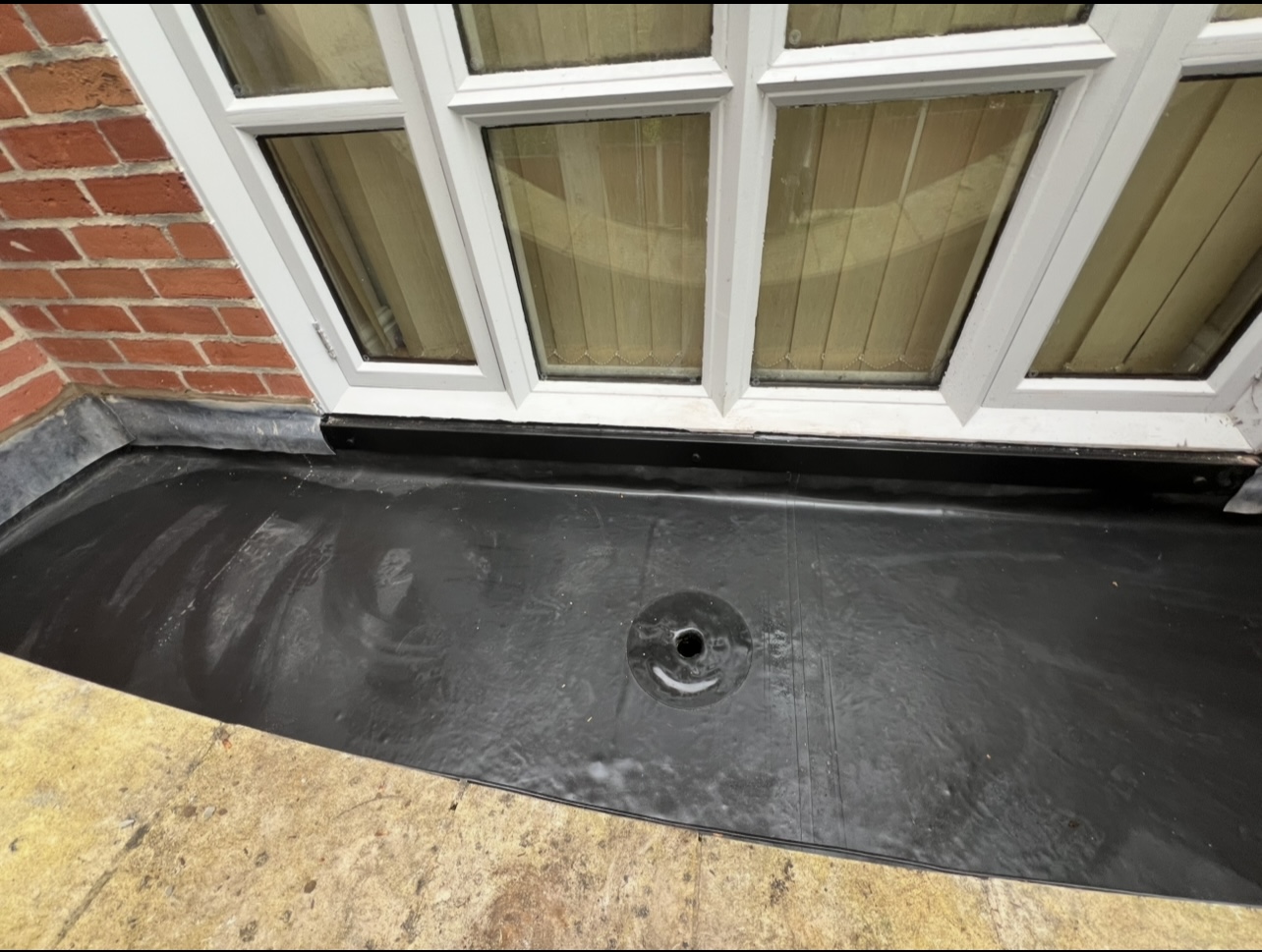 Flat roof junction detail — First Choice Roofing project