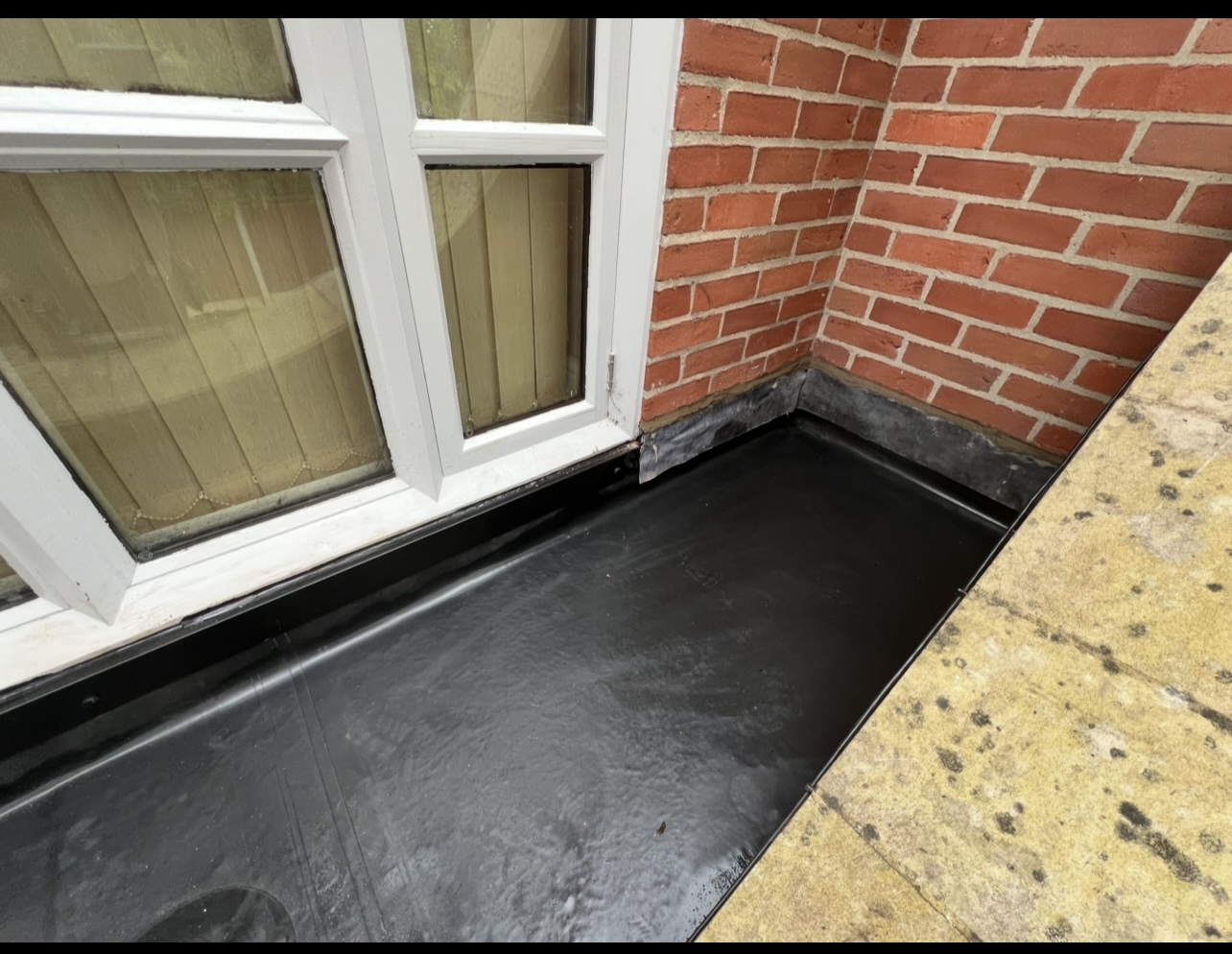 Flat roof junction detail — First Choice Roofing project